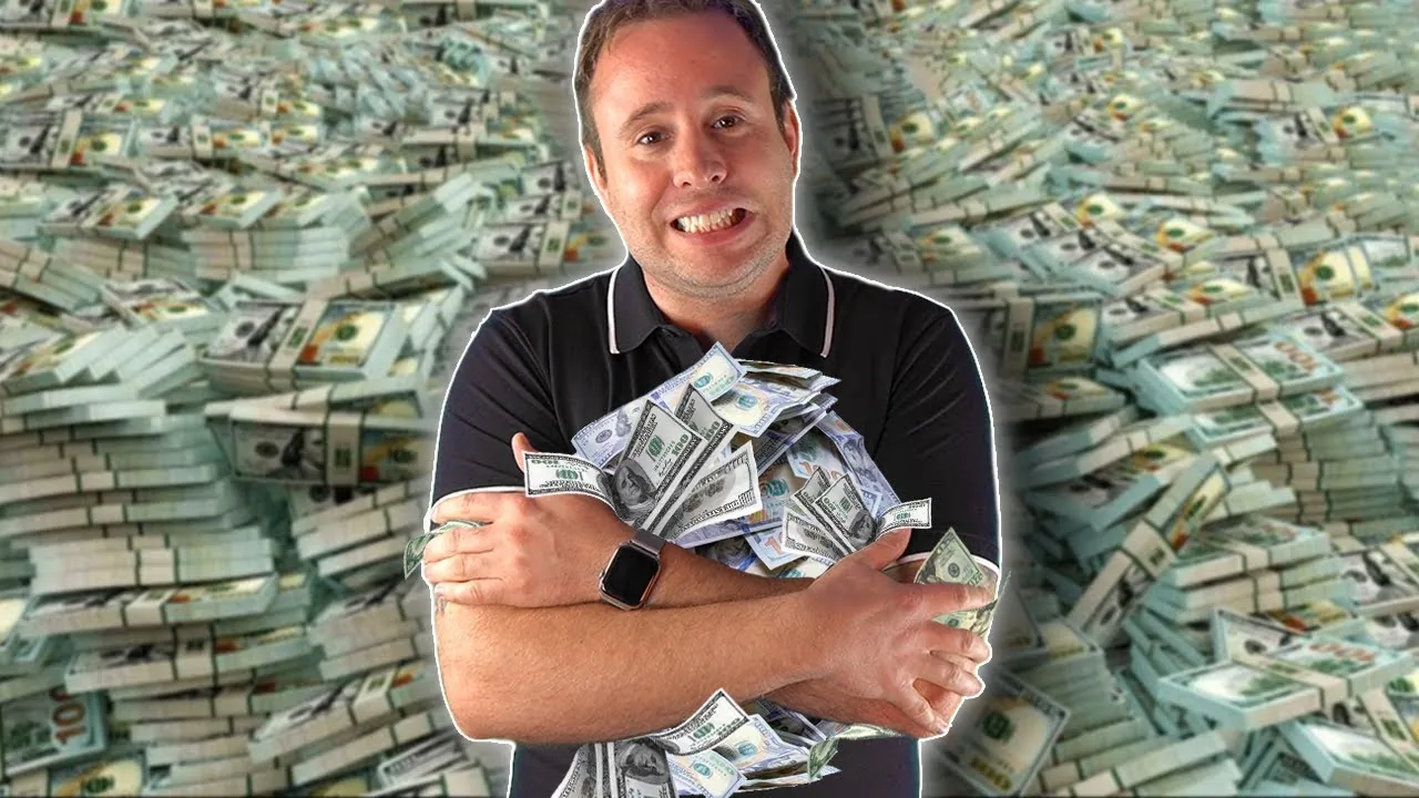 Mark Parham holding banknotes against a background of bundled money